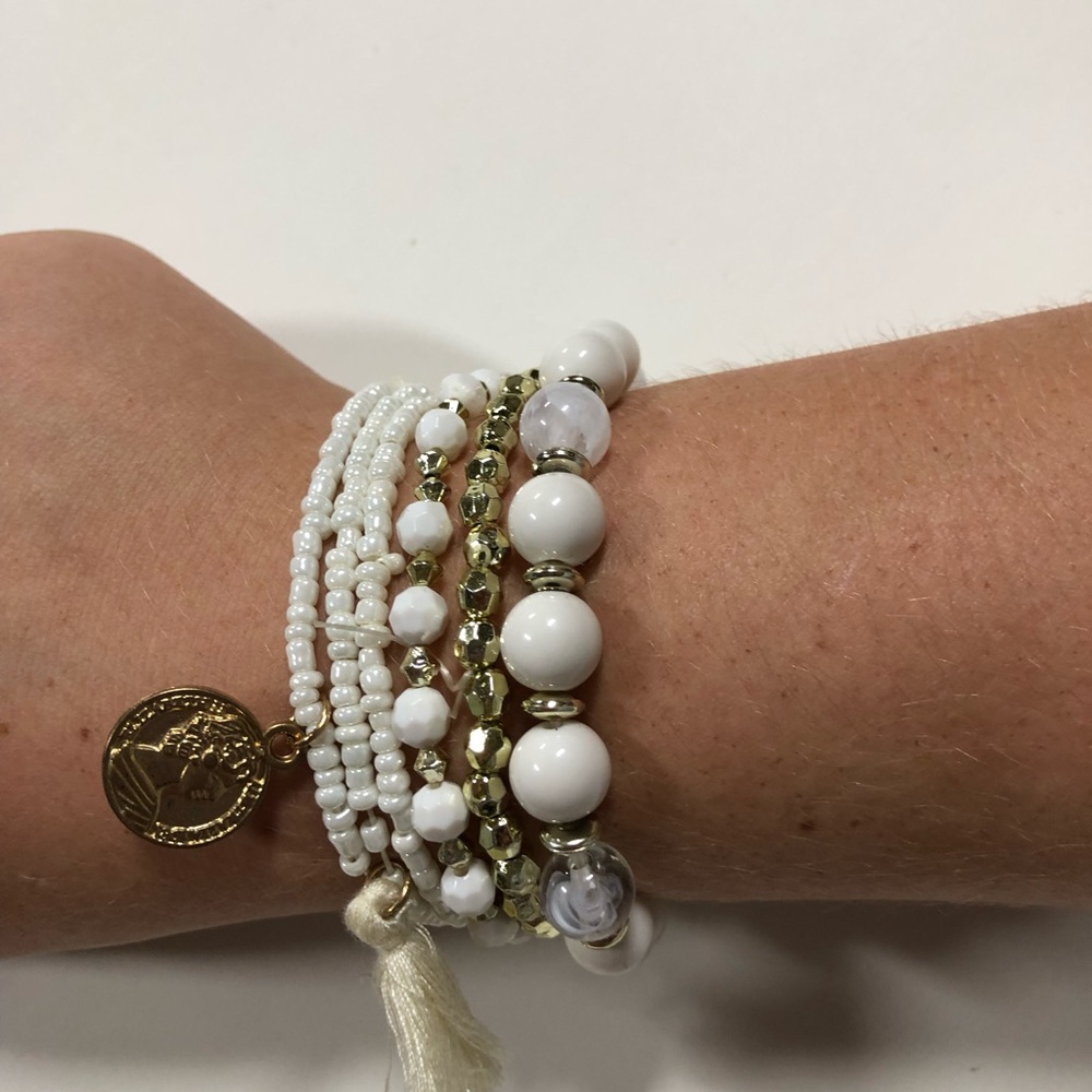 Boho beaded white and gold bracelet with tassel.